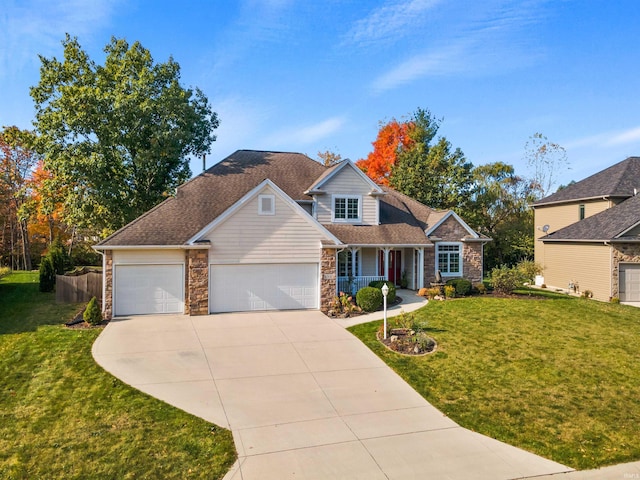 view of front of house featuring a porch, a garage, and a front yard