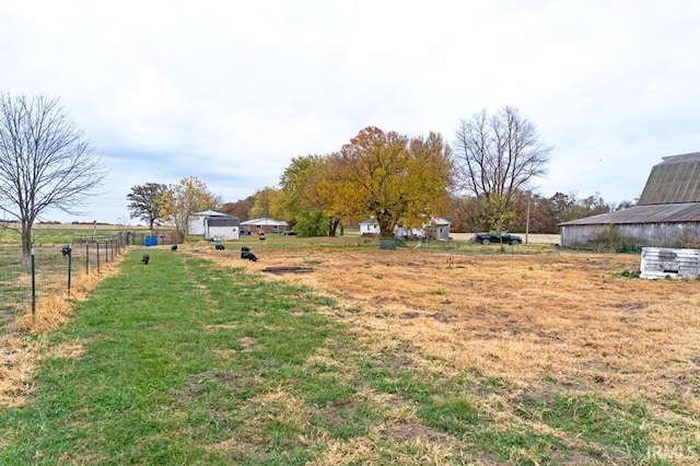 view of yard with a rural view