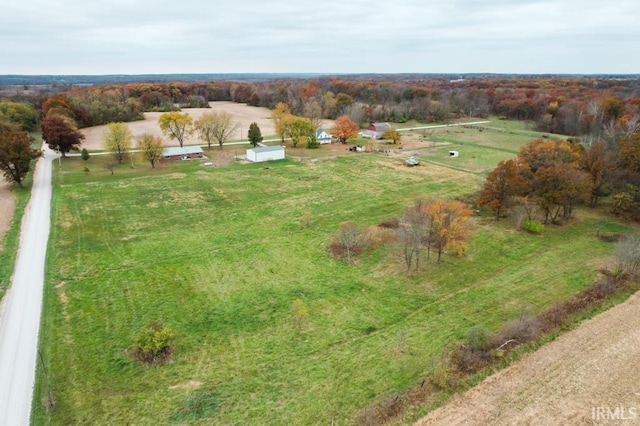 birds eye view of property with a rural view