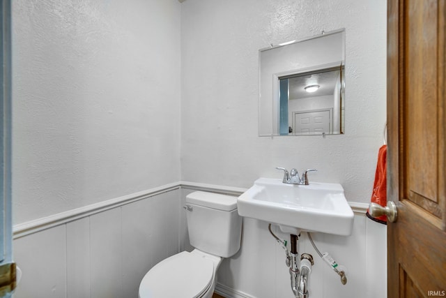 bathroom with toilet and sink