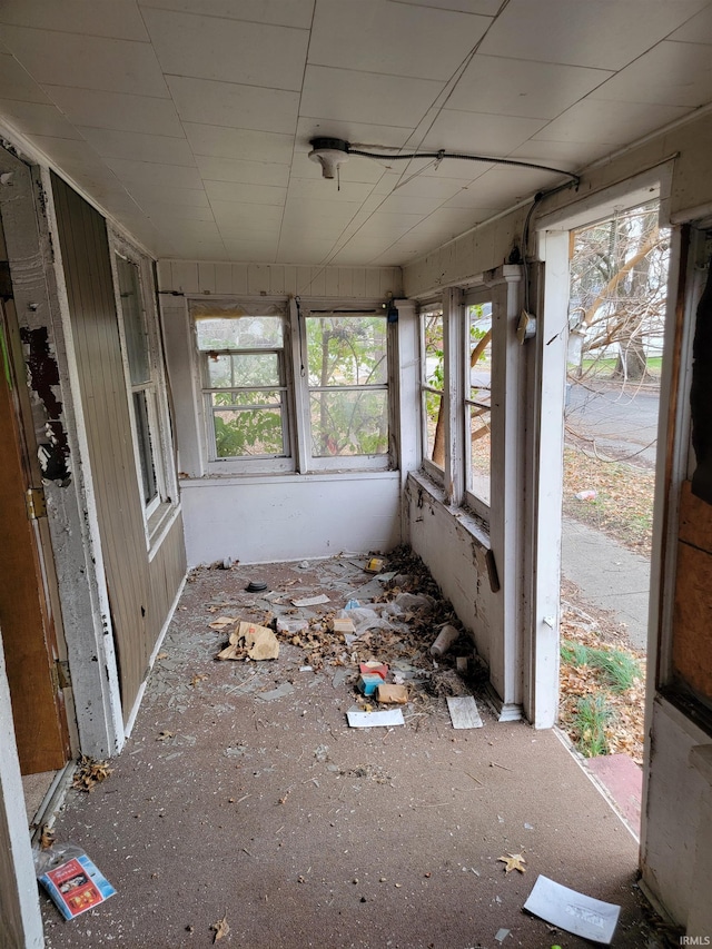 unfurnished sunroom featuring a wealth of natural light