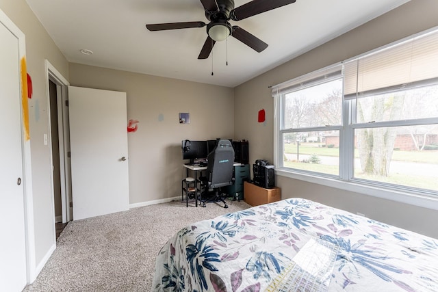 bedroom featuring light colored carpet and ceiling fan