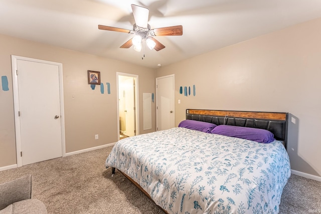 bedroom with ensuite bath, ceiling fan, and carpet floors