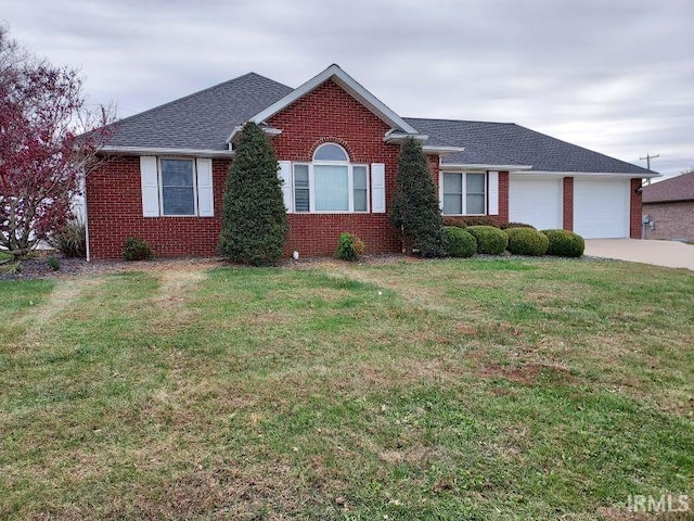 ranch-style home featuring a garage and a front lawn