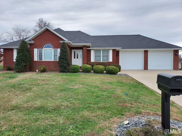 ranch-style house with a garage and a front lawn