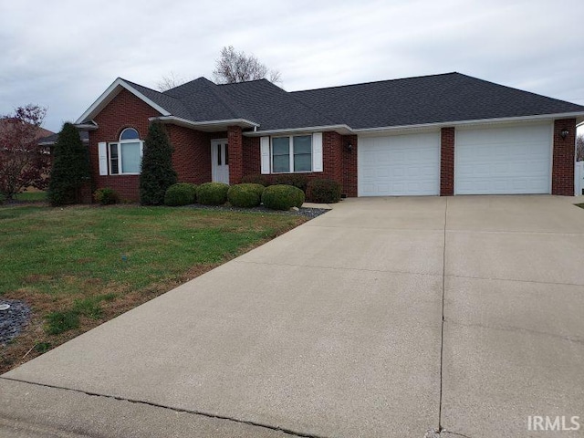 ranch-style home with a front yard and a garage