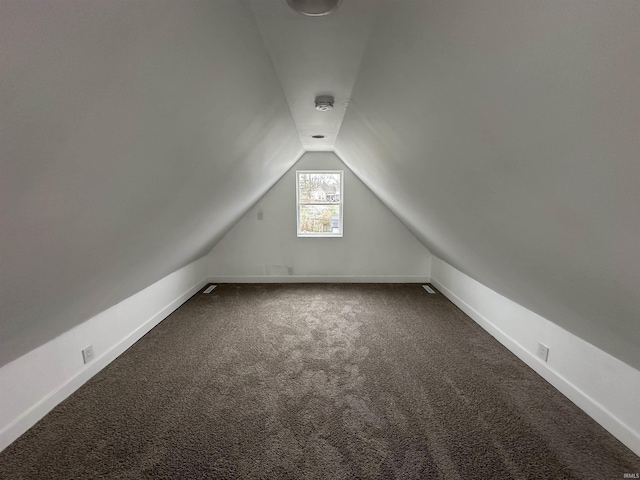 bonus room with carpet and vaulted ceiling