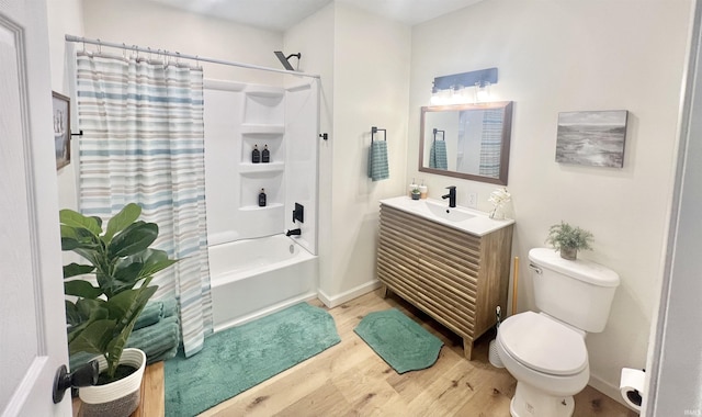 full bathroom with vanity, toilet, shower / bathtub combination with curtain, and hardwood / wood-style flooring