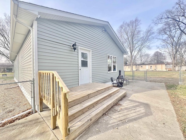 rear view of property featuring a patio area and a wooden deck