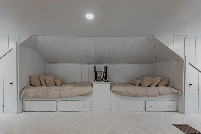 carpeted bedroom featuring lofted ceiling