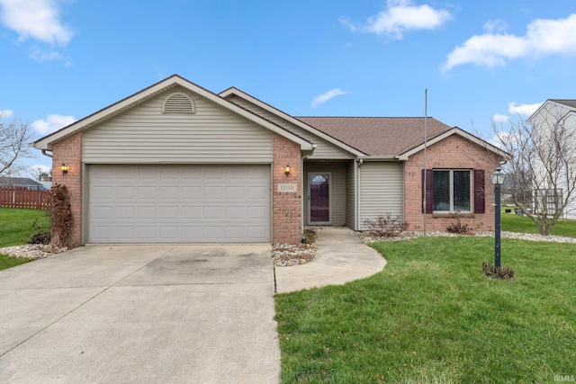 single story home with a garage and a front lawn