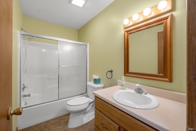 full bathroom with vanity, toilet, and bath / shower combo with glass door