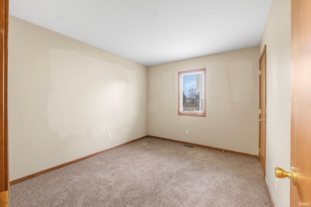 unfurnished room featuring carpet floors