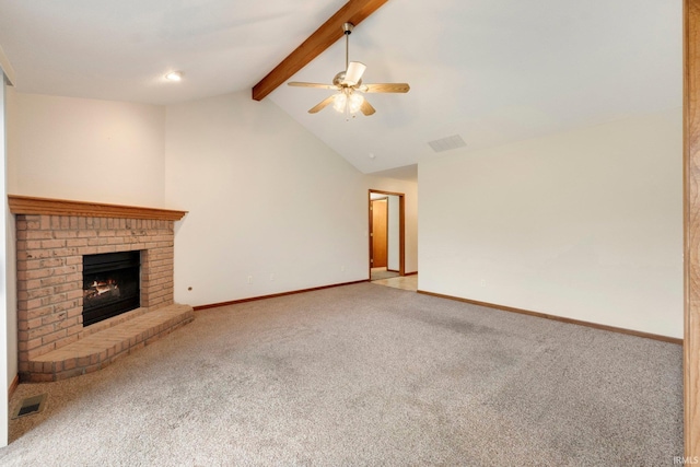 unfurnished living room featuring vaulted ceiling with beams, ceiling fan, a fireplace, and carpet floors