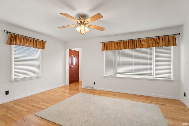 unfurnished room with ceiling fan and light hardwood / wood-style flooring