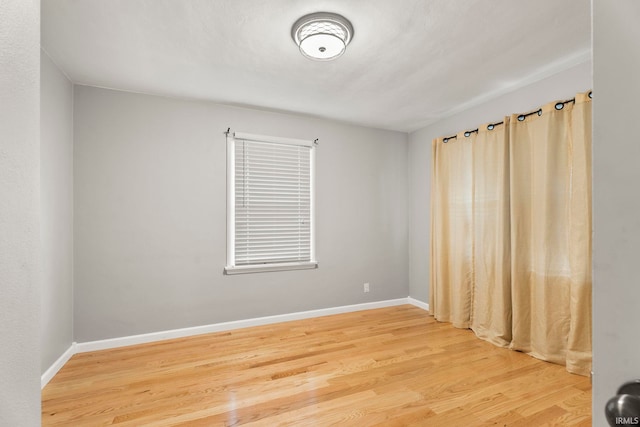 spare room featuring hardwood / wood-style floors