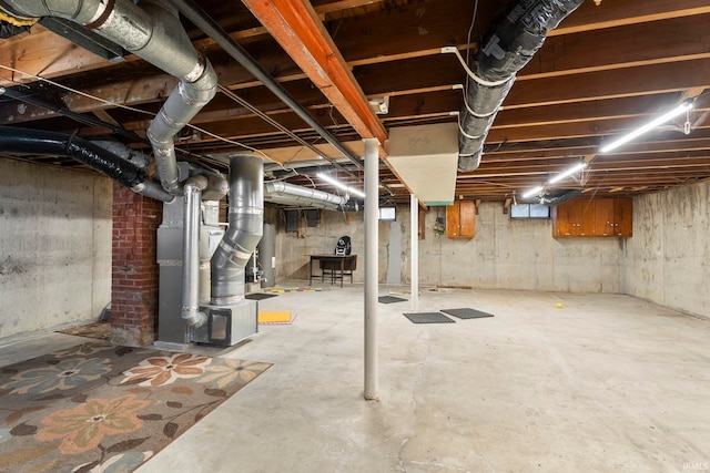 basement with heating unit and water heater