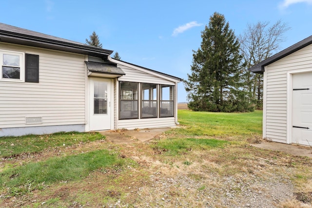 exterior space featuring a sunroom