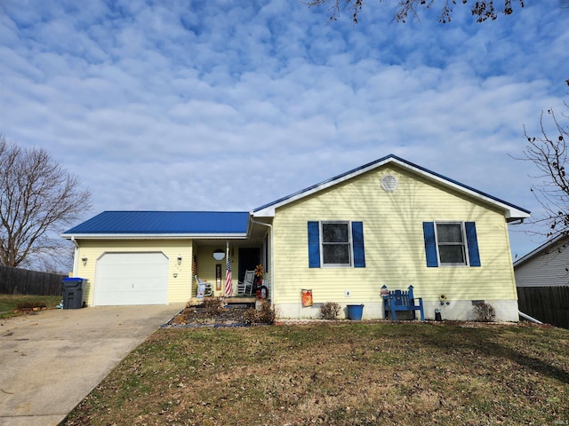 view of front facade featuring a garage and a front yard