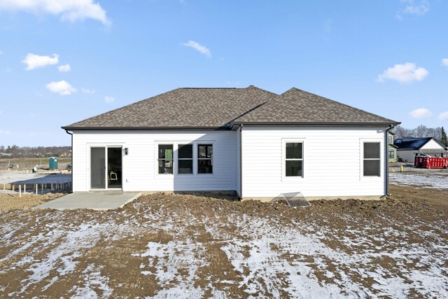 snow covered property featuring a patio area