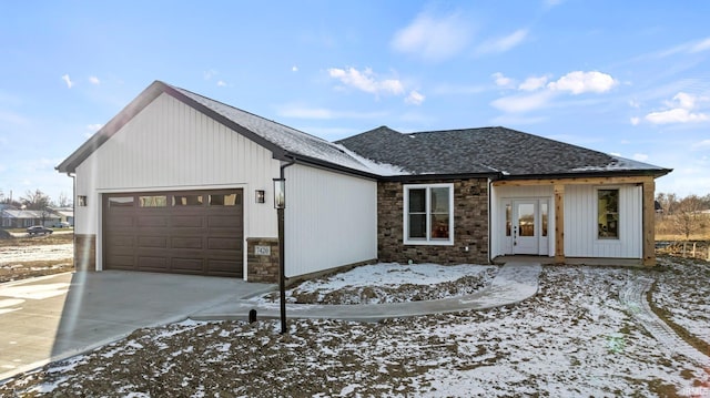 modern inspired farmhouse with a garage