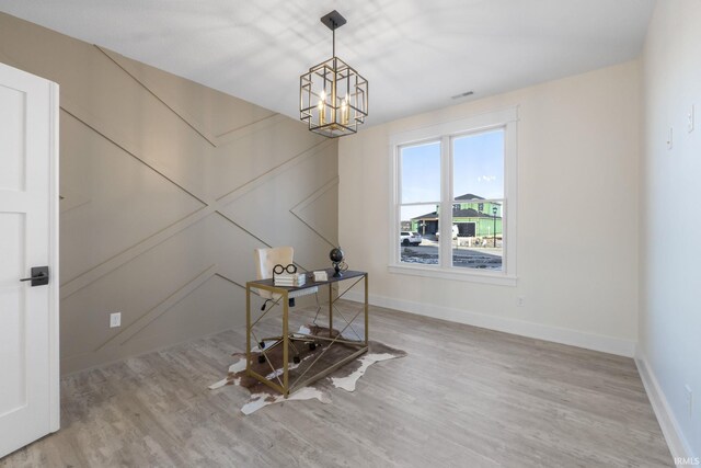 dining room featuring a chandelier and light hardwood / wood-style floors