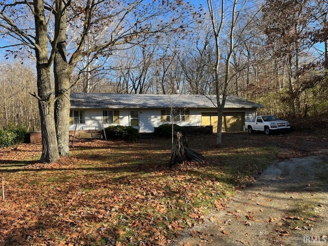 ranch-style home featuring a garage