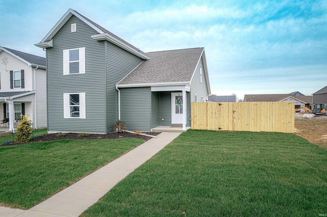 view of property with a front lawn