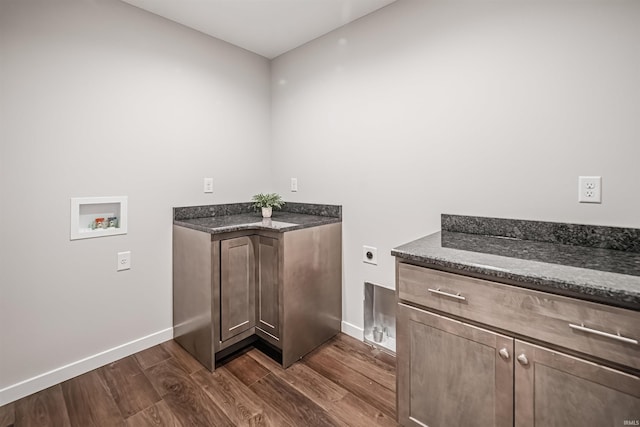 clothes washing area featuring hookup for an electric dryer, hookup for a washing machine, cabinets, and dark wood-type flooring