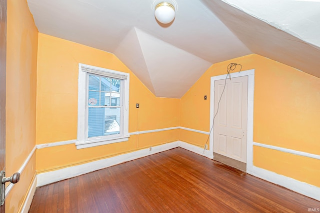 bonus room featuring wood-type flooring and vaulted ceiling