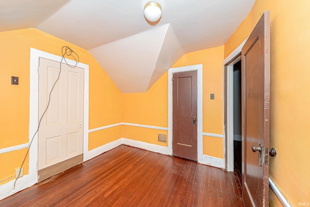 bonus room featuring dark hardwood / wood-style floors and lofted ceiling