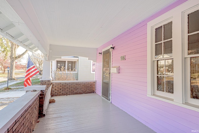 deck featuring covered porch