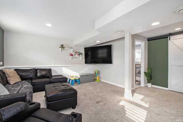 carpeted living room with a barn door