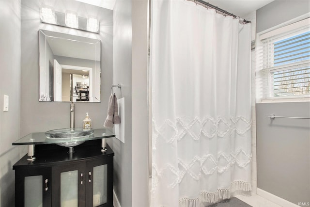 bathroom with vanity and curtained shower