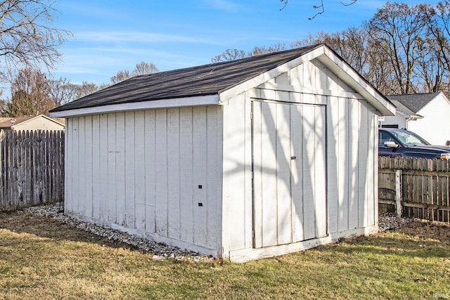 view of outbuilding with a lawn