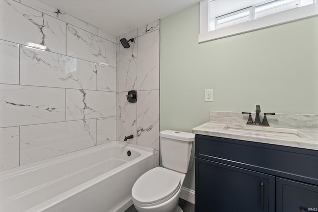 full bathroom featuring vanity, toilet, and tiled shower / bath