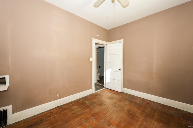 unfurnished room with ceiling fan and hardwood / wood-style floors