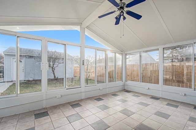 unfurnished sunroom with lofted ceiling with beams and ceiling fan