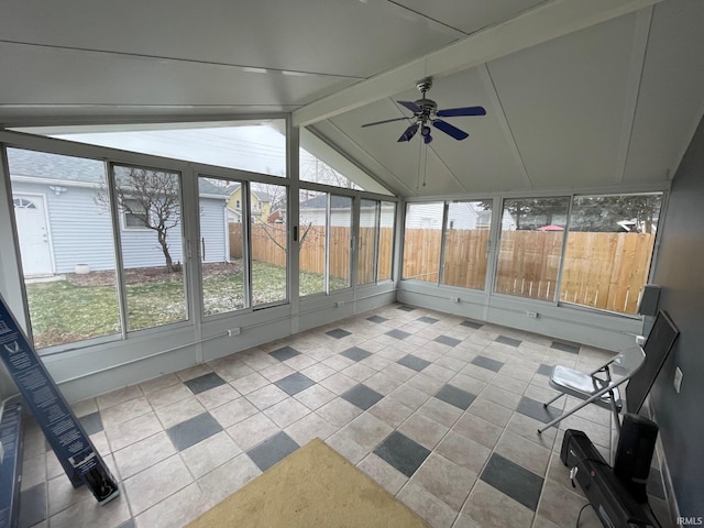 unfurnished sunroom with lofted ceiling with beams and ceiling fan