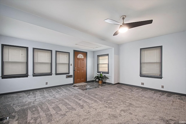 empty room with carpet flooring and ceiling fan