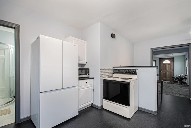 kitchen with backsplash, kitchen peninsula, white cabinetry, and white appliances