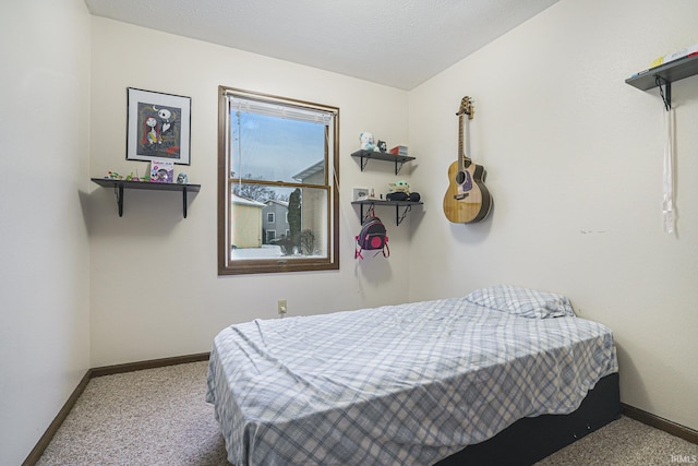 carpeted bedroom with a textured ceiling