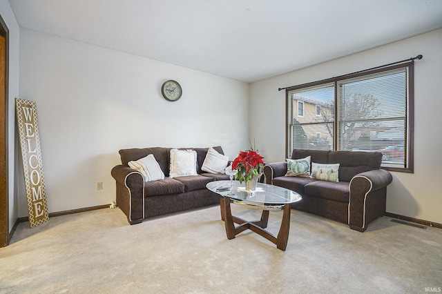 living room featuring light carpet