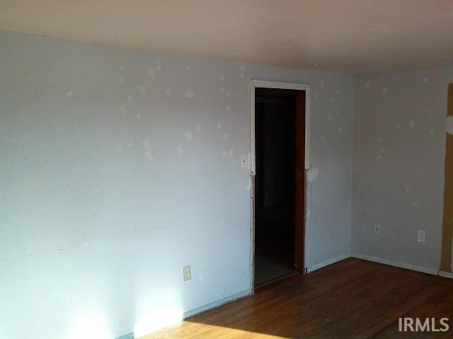 empty room with wood-type flooring