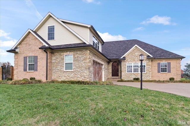 view of front of property with a garage and a front lawn