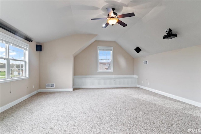 bonus room with ceiling fan, carpet, and vaulted ceiling