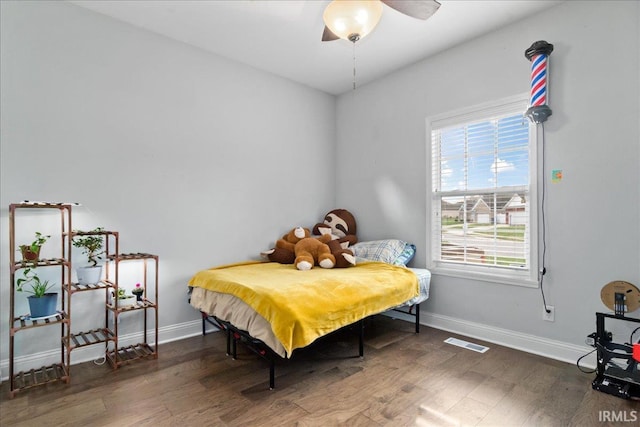 bedroom featuring ceiling fan and dark wood-type flooring