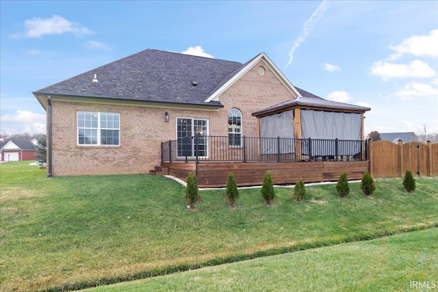 rear view of house with a lawn