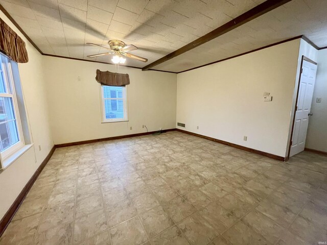 unfurnished room with ceiling fan and ornamental molding