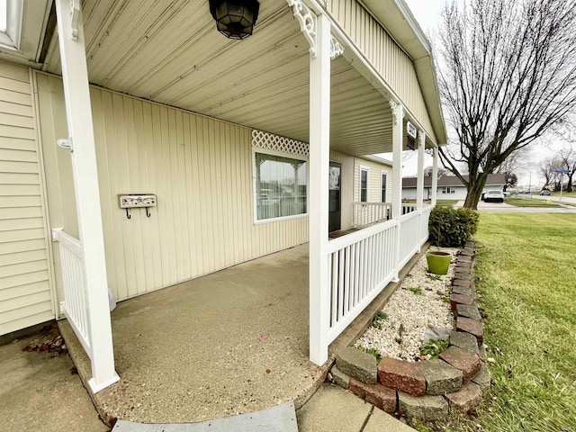 view of property exterior with a lawn and covered porch